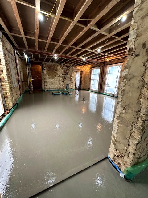 Screed pumped and levelled across an open-plan floor